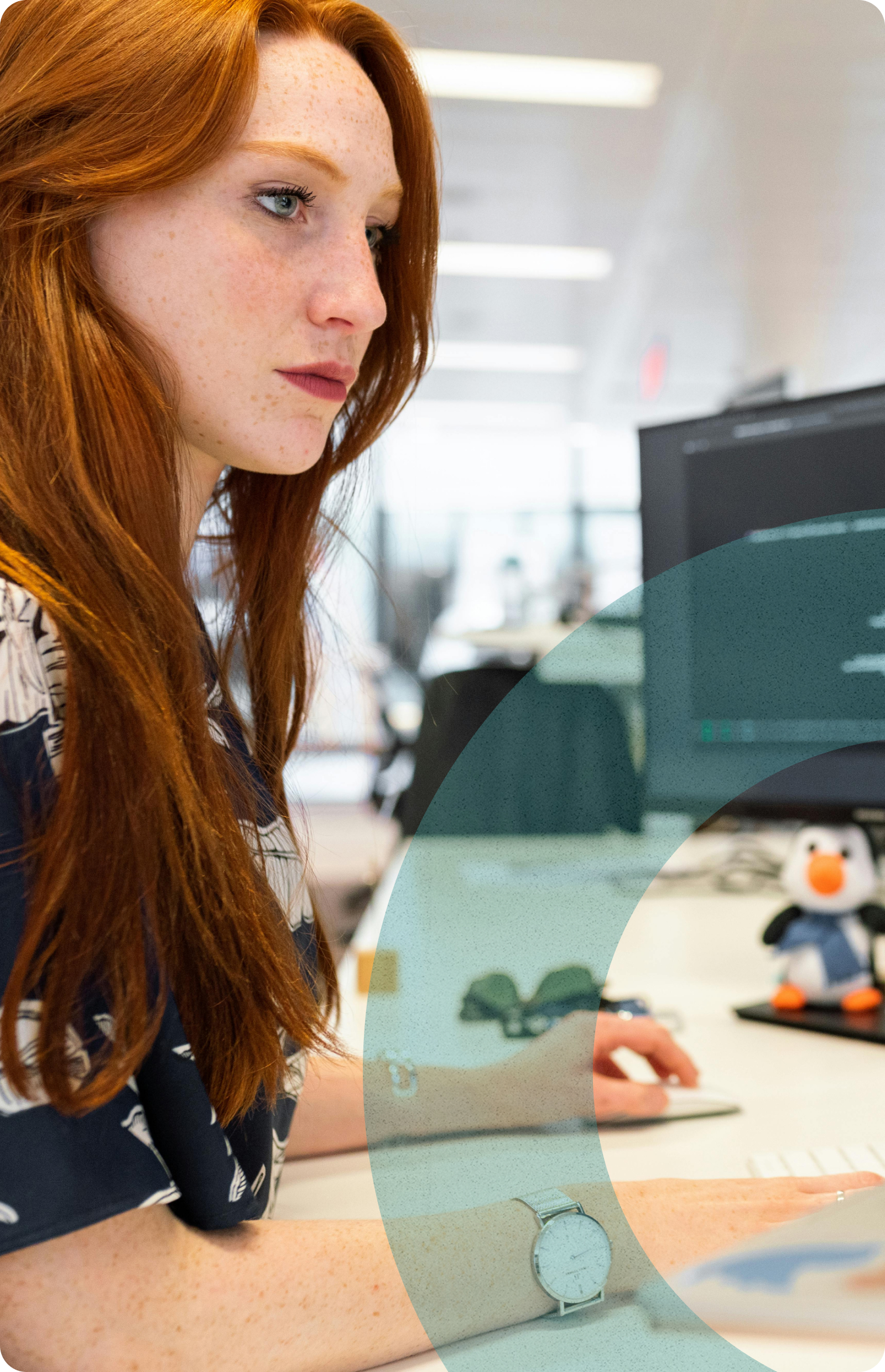 A woman looking at a computer screen