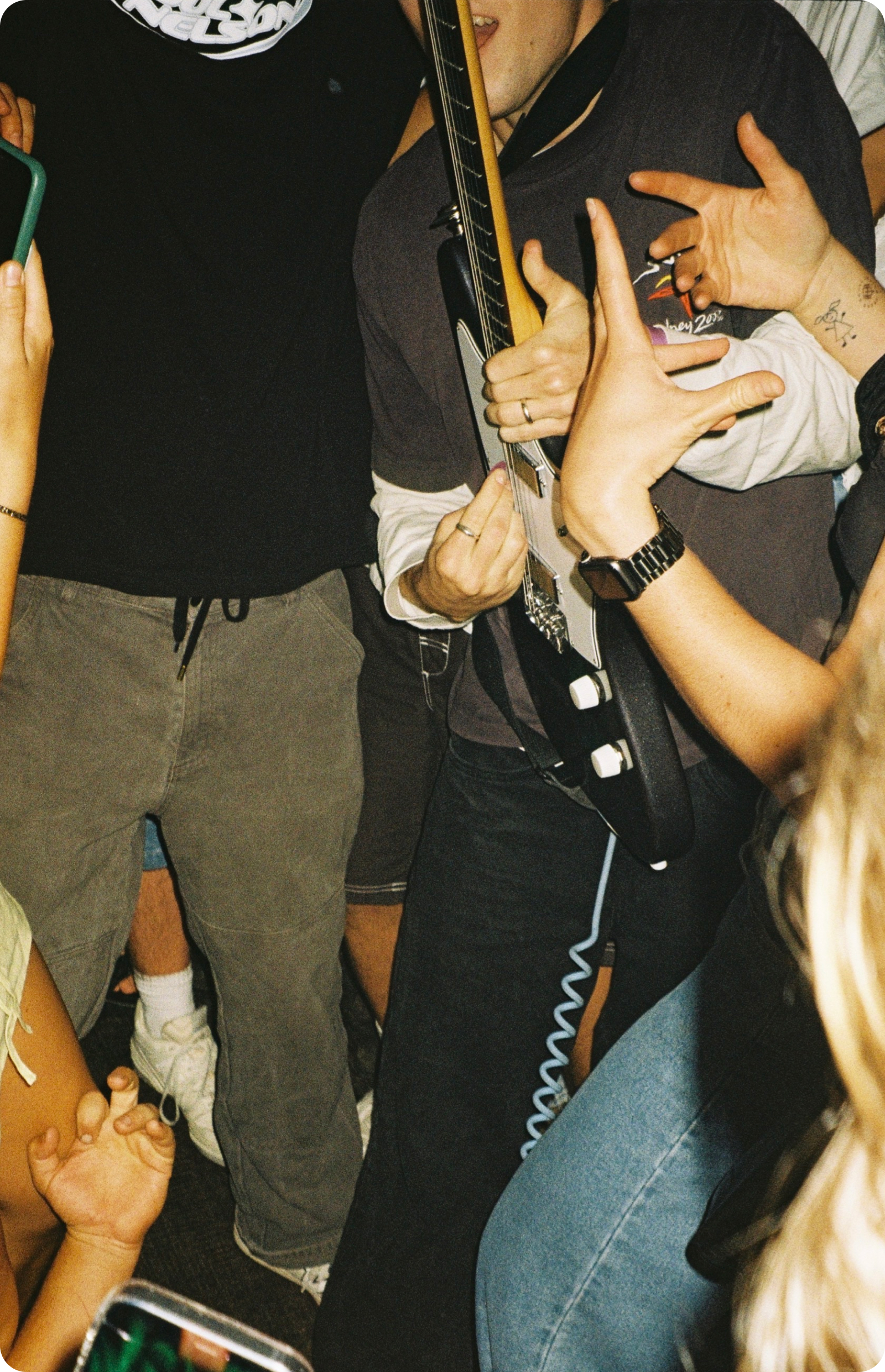 a group of people holding a guitar